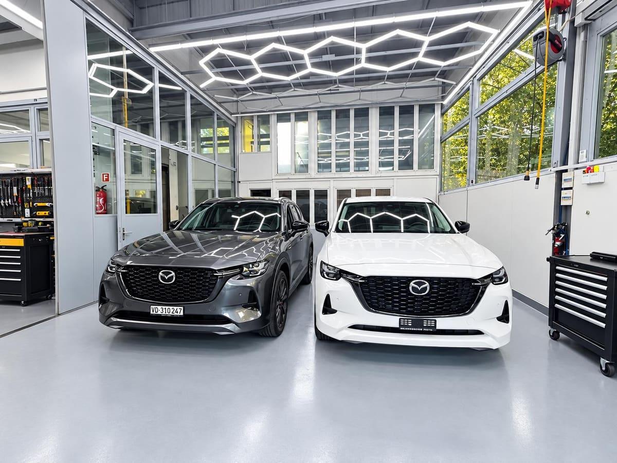 Deux SUV dans l'atelier lumineux de Carrosserie Pista